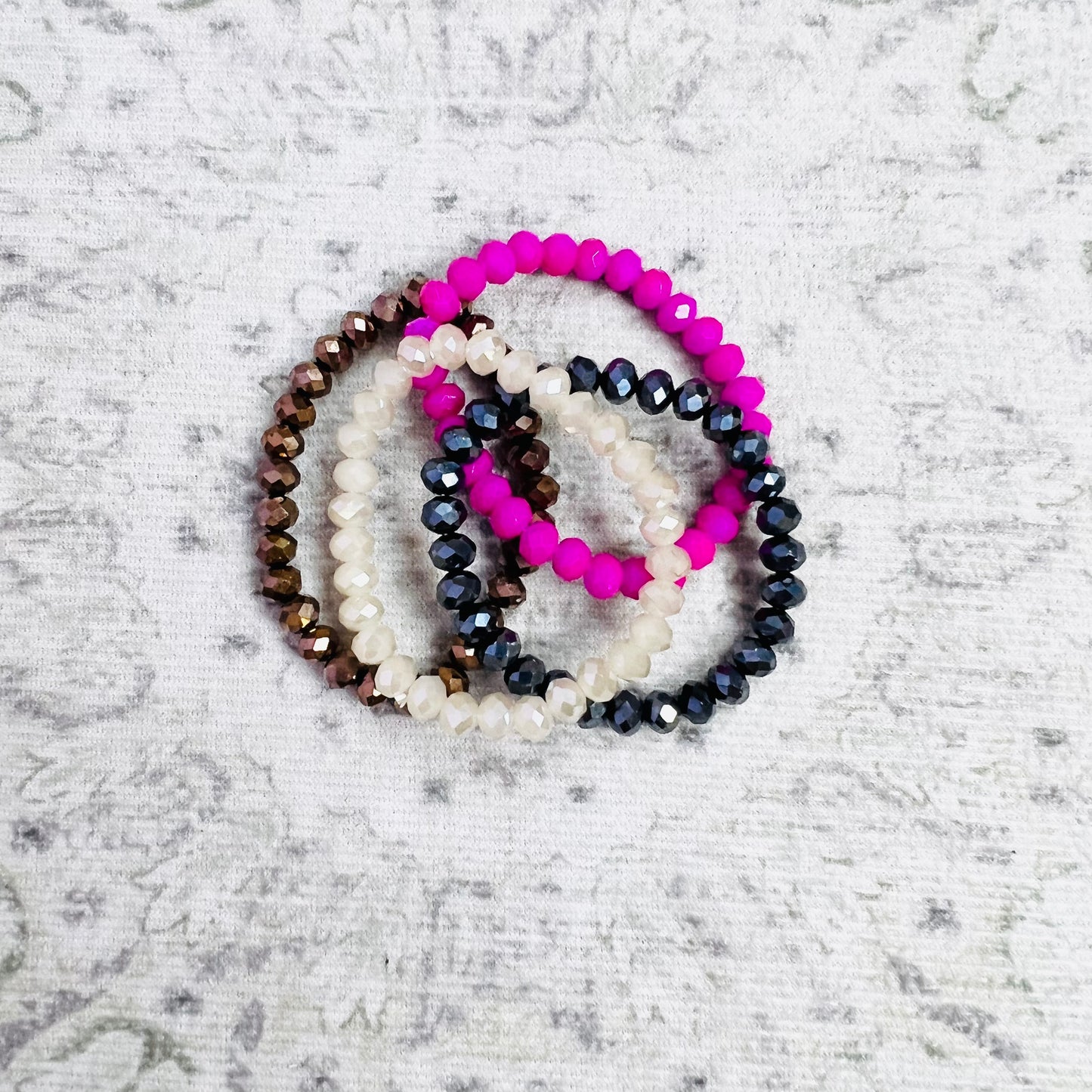 Fuchsia, Black, Brown, and Clear Beaded Bracelet Stack